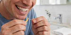 Dental bridge cleaning with a floss threader — Eagle Family Dentistry, Newmarket